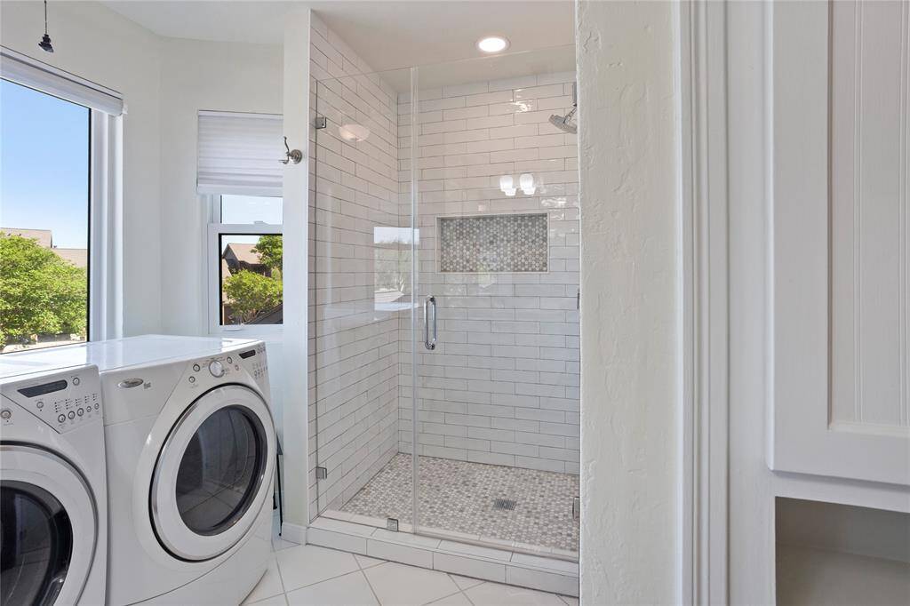 Laundry was relocated to the primary bathroom for ultimate convenience.  Washer & dryer can convey.  The recently updated shower features beautiful white subway tile.