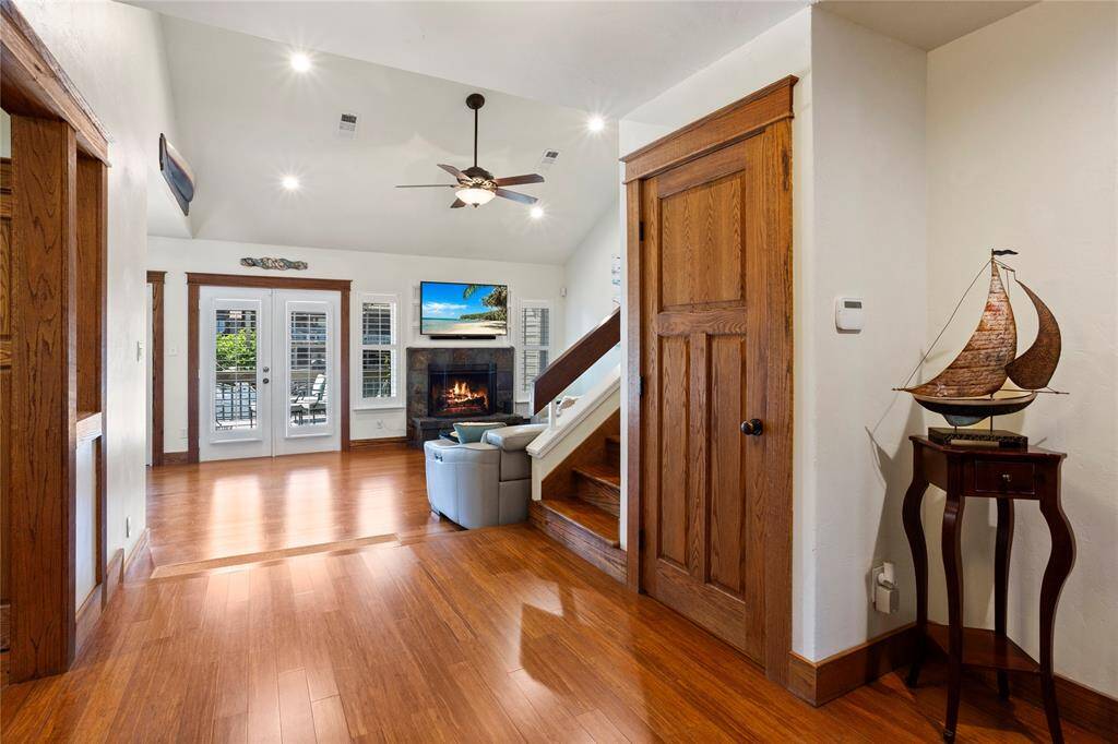 As you enter, you'll be greeted by rich bamboo flooring and stunning, custom wood trim and moldings that add warmth and sophistication throughout the space.