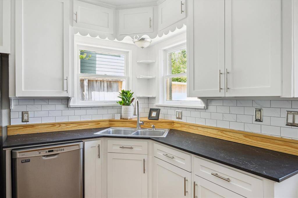 Love a corner window over the sink in the kitchen.  Views to the backyard.