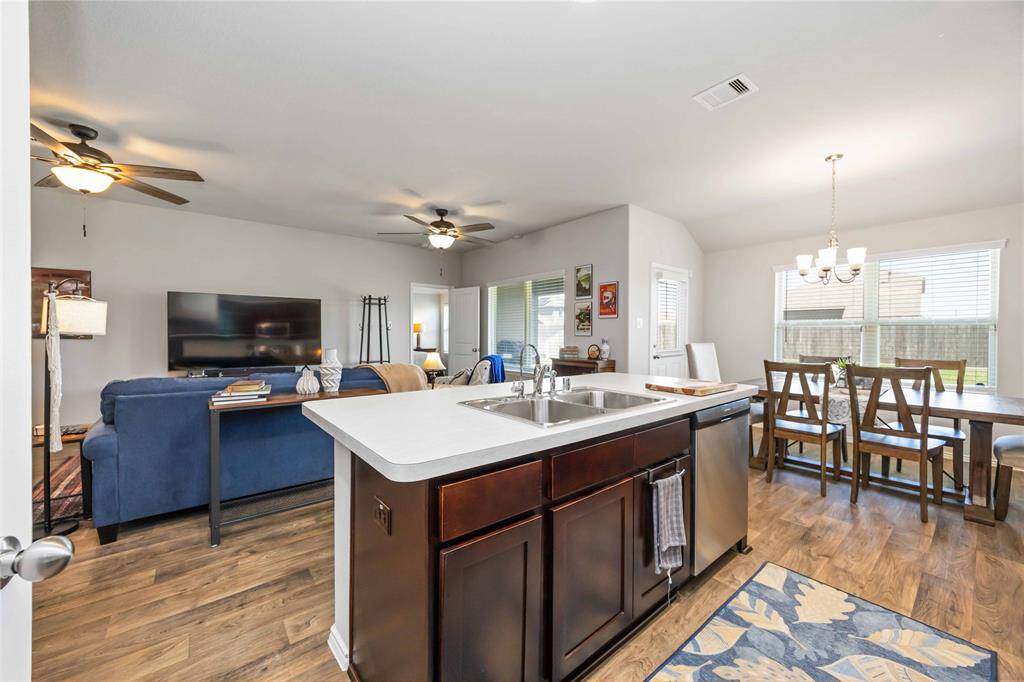 The kitchen flows effortlessly into the adjoining living and dining areas, creating an open space making every occasions memorable.