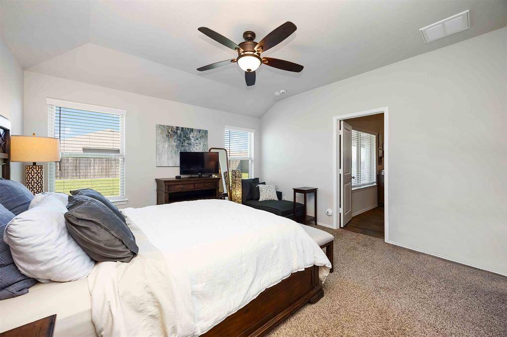 Enjoy carpet flooring and abundant natural light from the large windows in the primary bedroom—your personal retreat with a serene ambiance.