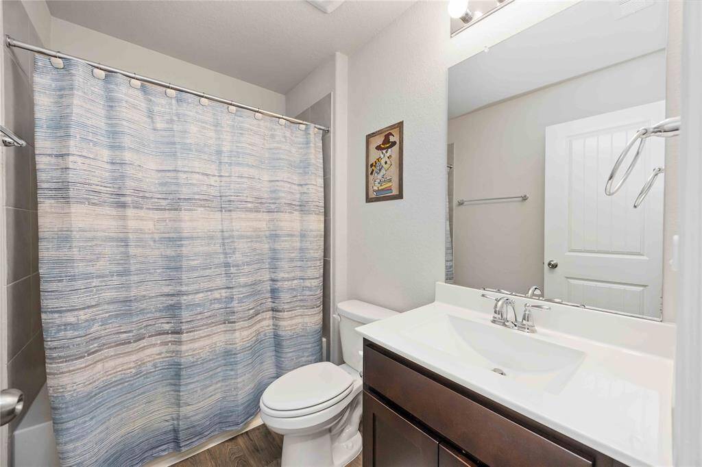 This secondary bathroom features a practical tub and shower combo.