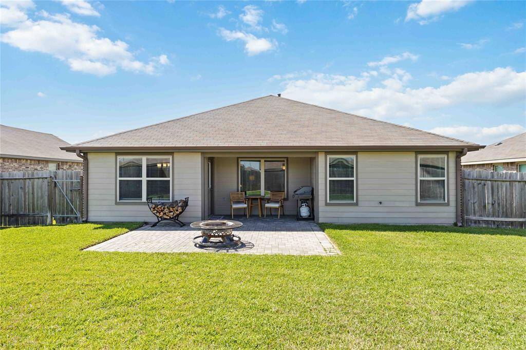 Relax or entertain year-round under a spacious covered patio, providing the ideal spot for lounging or al fresco dining.