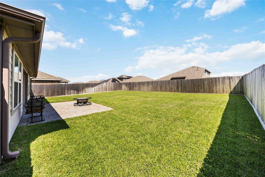 Enjoy a generously sized, fully fenced backyard with a well-maintained lawn—perfect for outdoor fun, pets, or future landscaping projects.