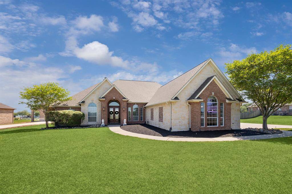 Welcome Home! Beautiful stone and brick accents are stunning on this home!