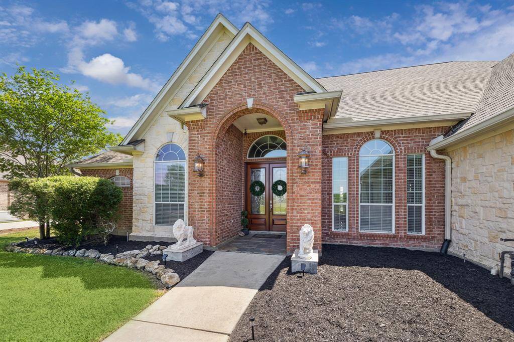 Welcome Home! Beautiful stone and brick accents are stunning on this home!