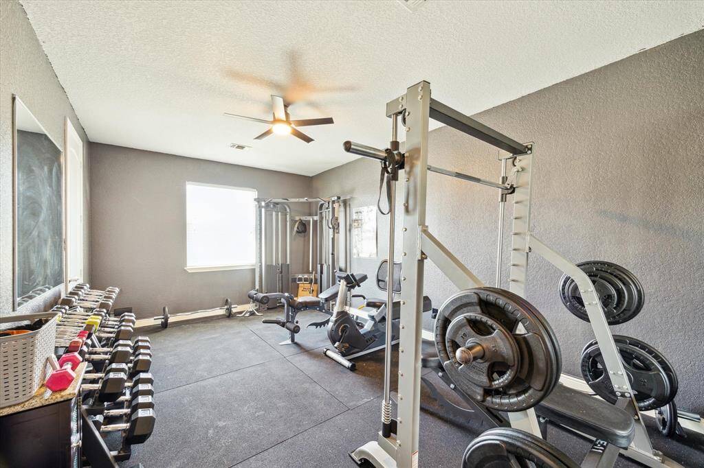 Fourth bedroom - has been converted to a weight room.  All of this equipment comes with the house.