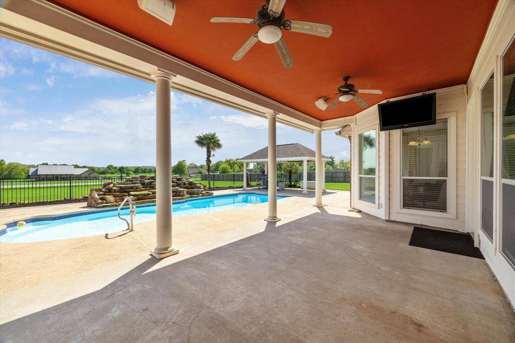 The covered back porch is huge and provides a great place to entertain.