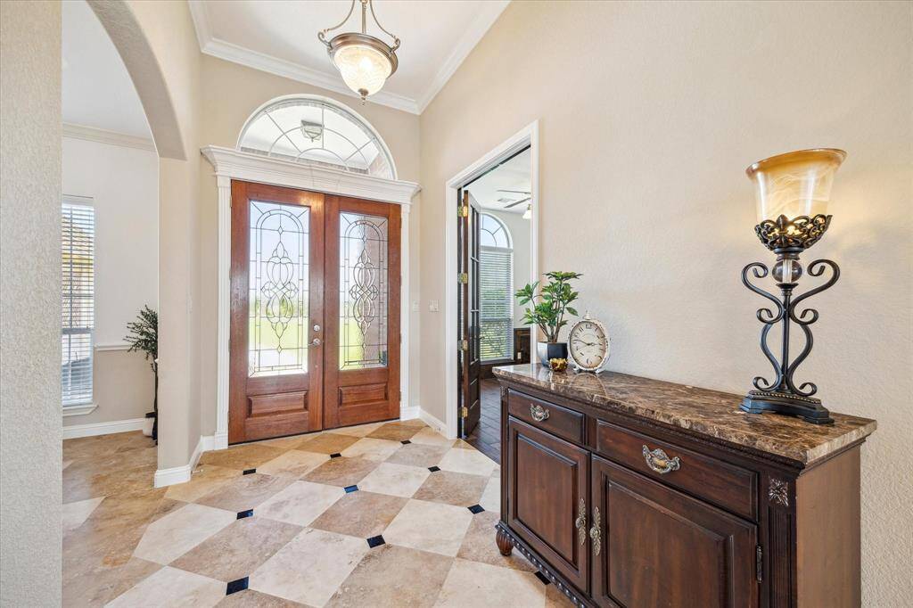 The double doors open right to your beautiful foyer and the breath taking view of your home!
