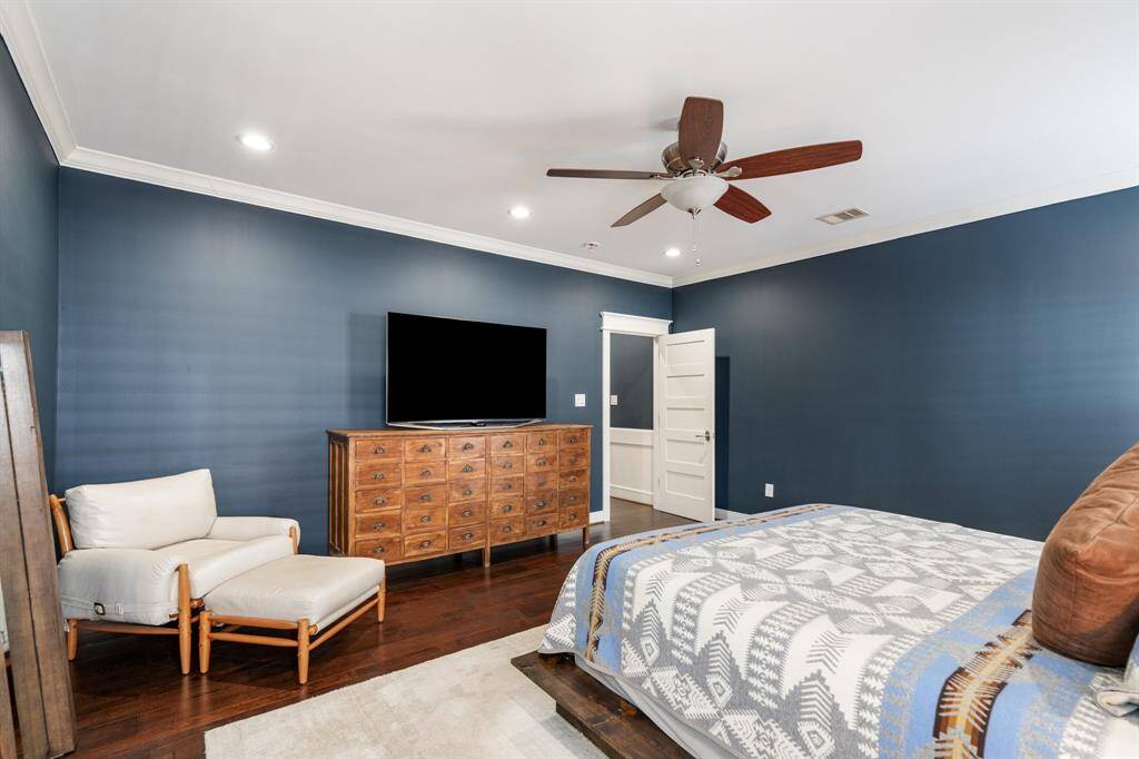 Additional view of master suite.  Thoughtful details like crown molding and recessed lighting enhance the room’s sophisticated appeal.