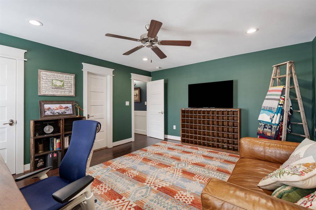 Another angle of this spacious third bedroom showcases the thoughtful design, with easy access to the hallway and additional doors leading to the bathroom and a spacious closet.