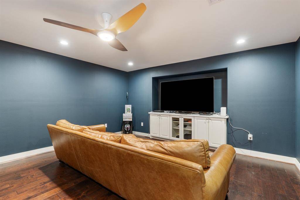 Designed for entertainment, this media room is a cozy retreat ideal for movie nights or gaming. The tucked-away design provides a quiet and immersive space for relaxation.