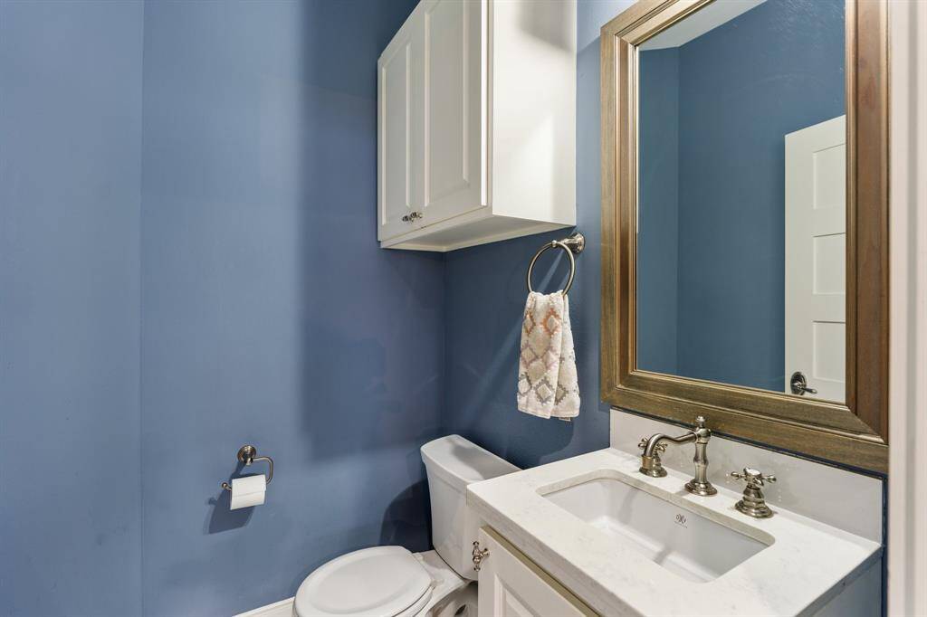 A charming powder room conveniently located on the first floor.