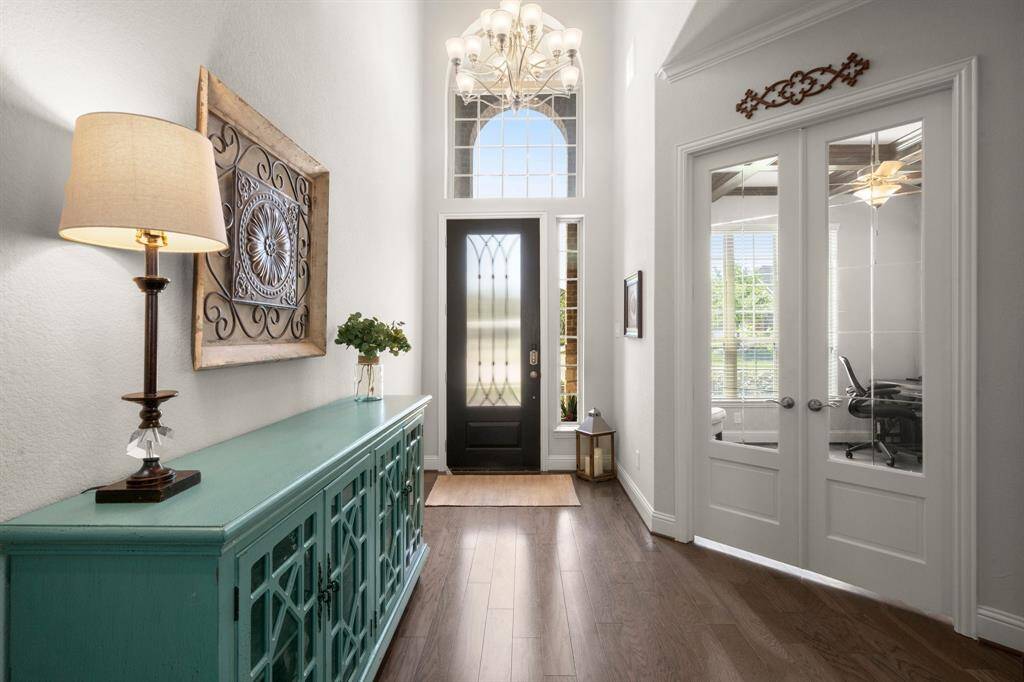 Rich hardwood floors extend into the heart of the home, setting the tone for timeless design.