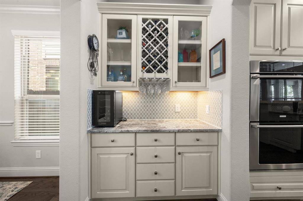 Connecting the kitchen and dining room, the butler’s pantry includes a built-in wine and coffee bar for seamless hosting.
