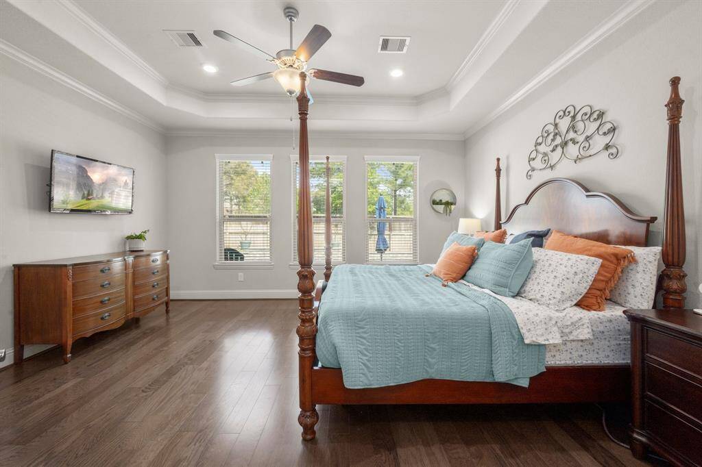 Windows with blinds offer privacy without sacrificing natural light. This serene retreat opens to an ensuite that redefines relaxation.