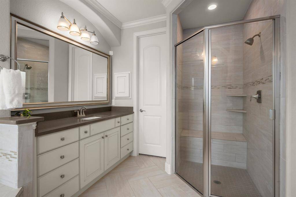 Unwind in a luxurious ensuite with silestone countertops and dual vanity areas designed for his and her comfort.