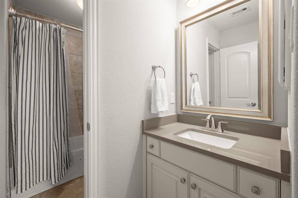 Two of the bedrooms share a thoughtfully designed Jack-and-Jill bathroom.