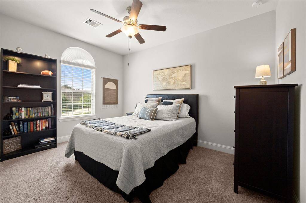 Upstairs you'll find three generously sized bedrooms with cozy carpeting, ceiling fans, and window blinds for comfort and style.