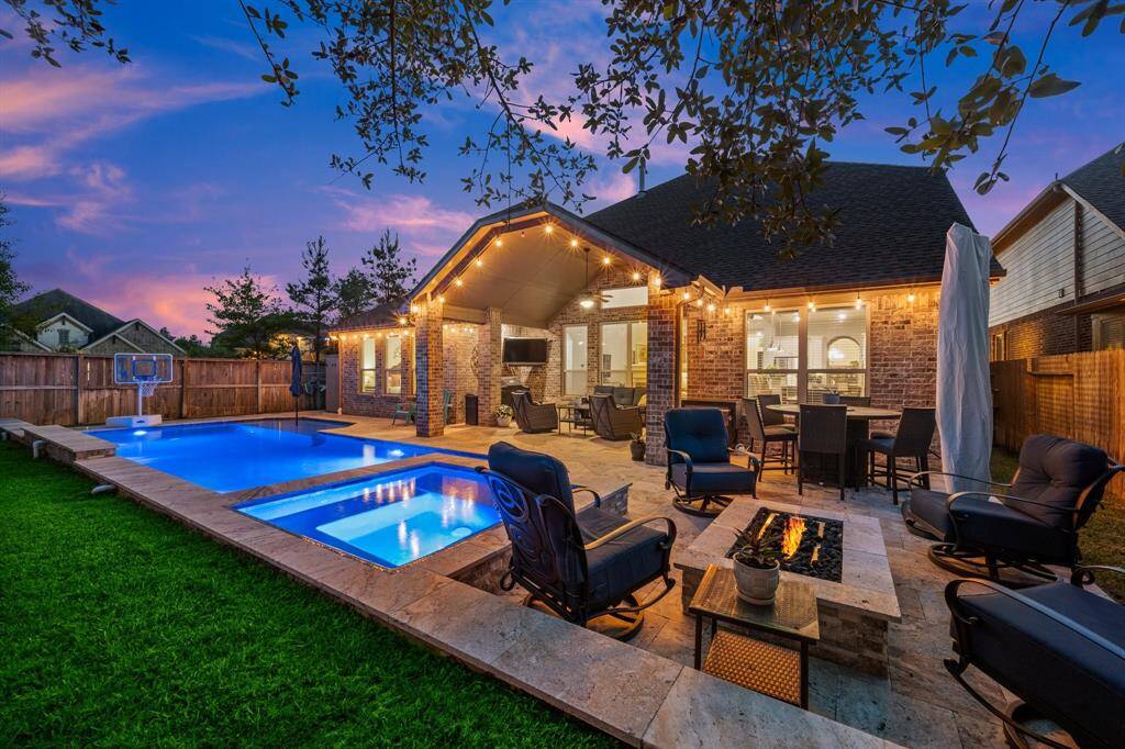 Whether you're soaking in the hot tub with the neck roll, enjoying the soothing water features, or gathering around the firepit under the stars, this outdoor space is designed to impress.