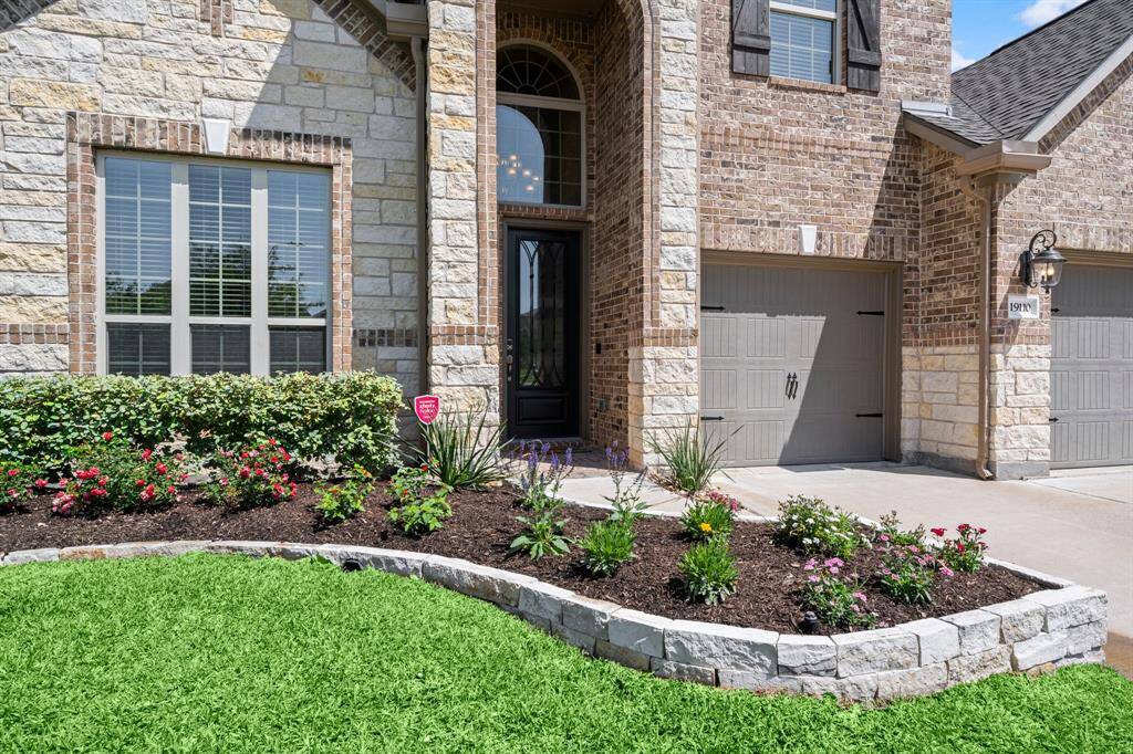 A welcoming entry and thoughtfully designed exterior create an inviting first impression.