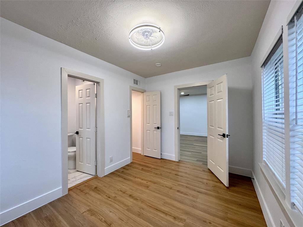 Front bedroom, bath door on left, and walk-in closet next to it.