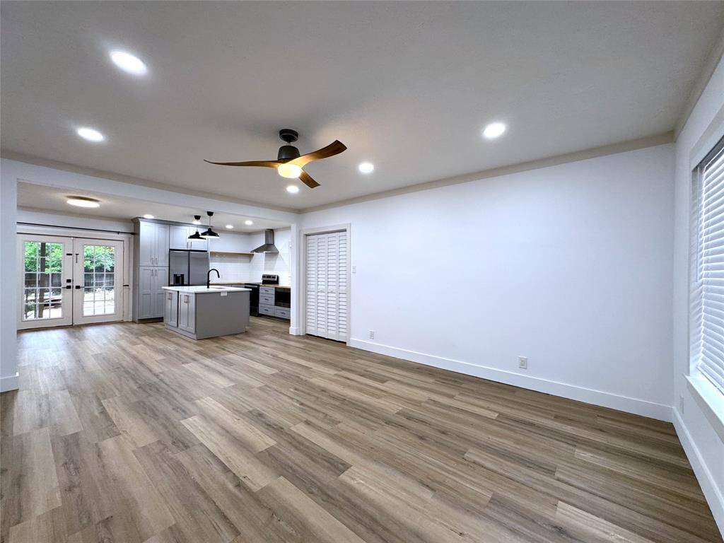 Open floor plan with dining area conveniently located next to the kitchen and back door, for ease of access to the oversized deck and garage parking.