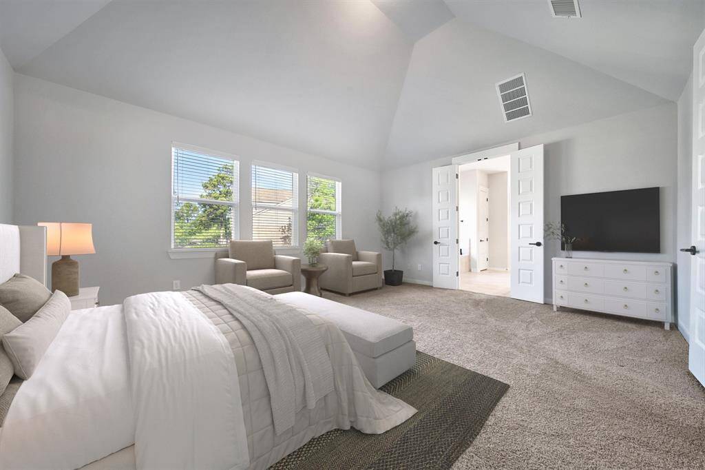 View of primary bedroom. Virtually staged.
