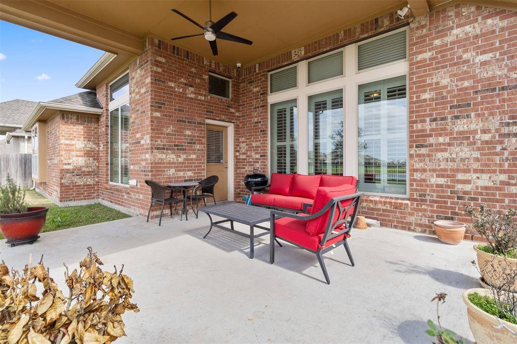 Spacious backyard and extended covered patio overlooking the lake