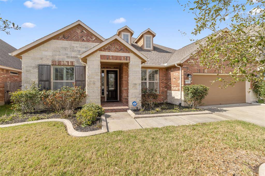 Beautifully landscapedsingle story home on a lake lot