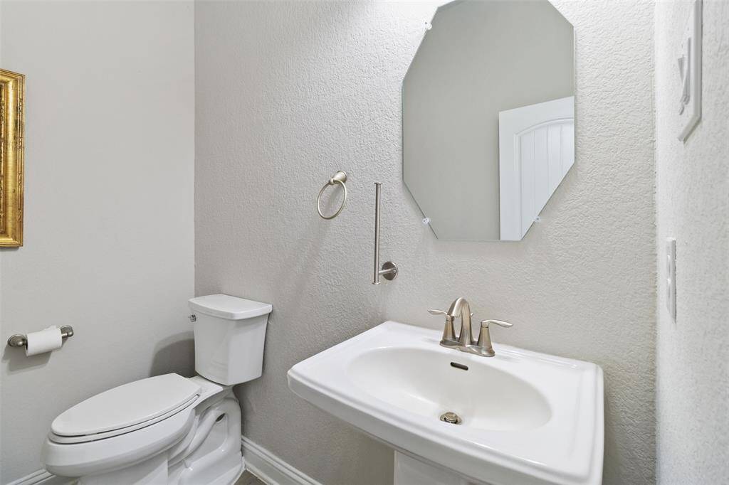 Half bath, raised commode for comfort