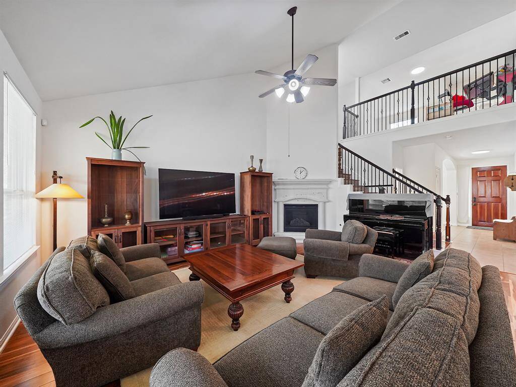 A cozy corner gas log fireplace creates a warm and inviting ambiance, perfect for relaxing evenings.