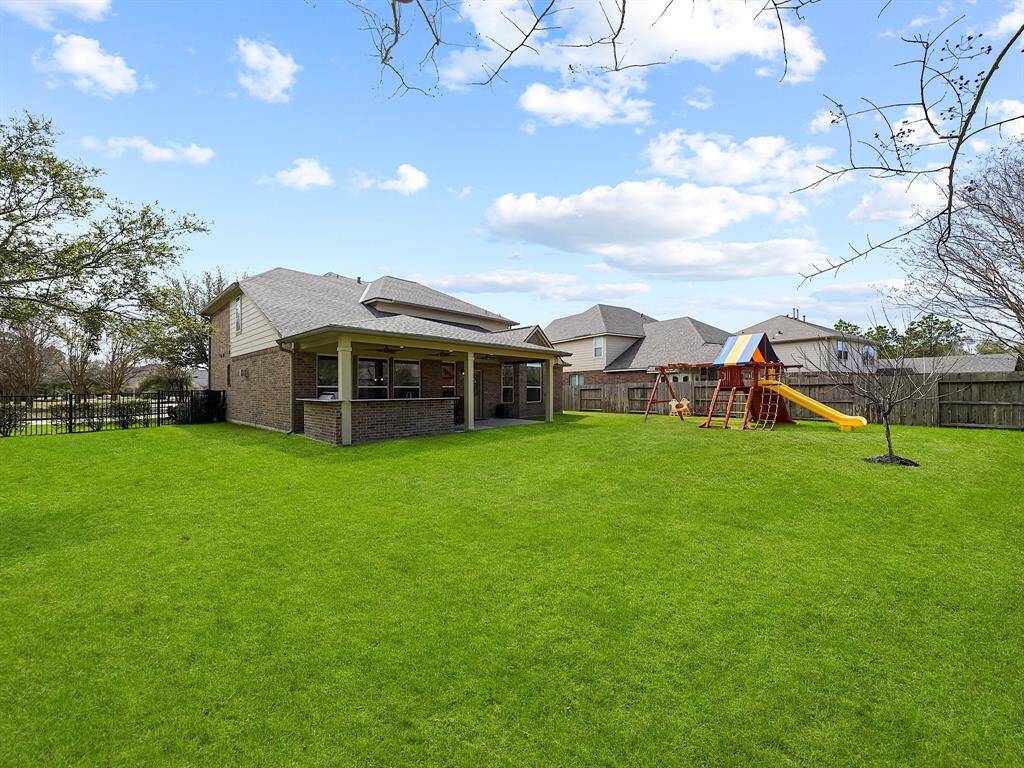Enjoy the ample green space with tons of room for a pool.
