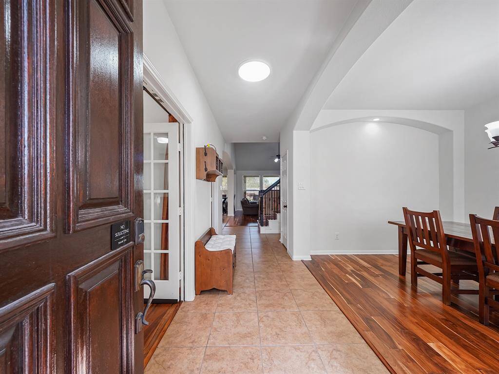 Step inside and be greeted by a light and bright interior with soaring ceilings and engineered hardwood floors that flow throughout the main living areas.