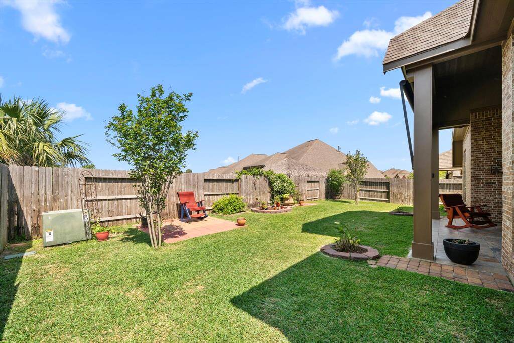 From this view, you can see just how spacious and versatile the backyard is. It’s perfect for gardening, playing, or creating your own outdoor sanctuary.