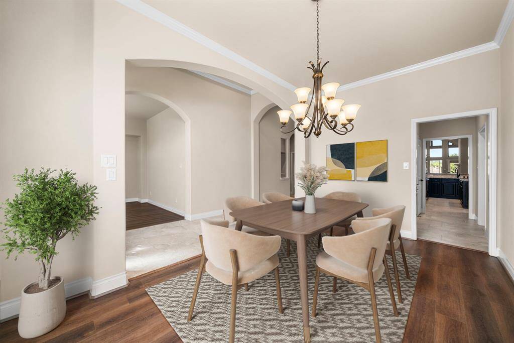 This spacious dining room offers a seamless flow into the rest of the home, with plenty of room to accommodate entertaining with ease. Classic tile transitions and soft neutral walls add a polished and inviting touch. *Virtual Staged*