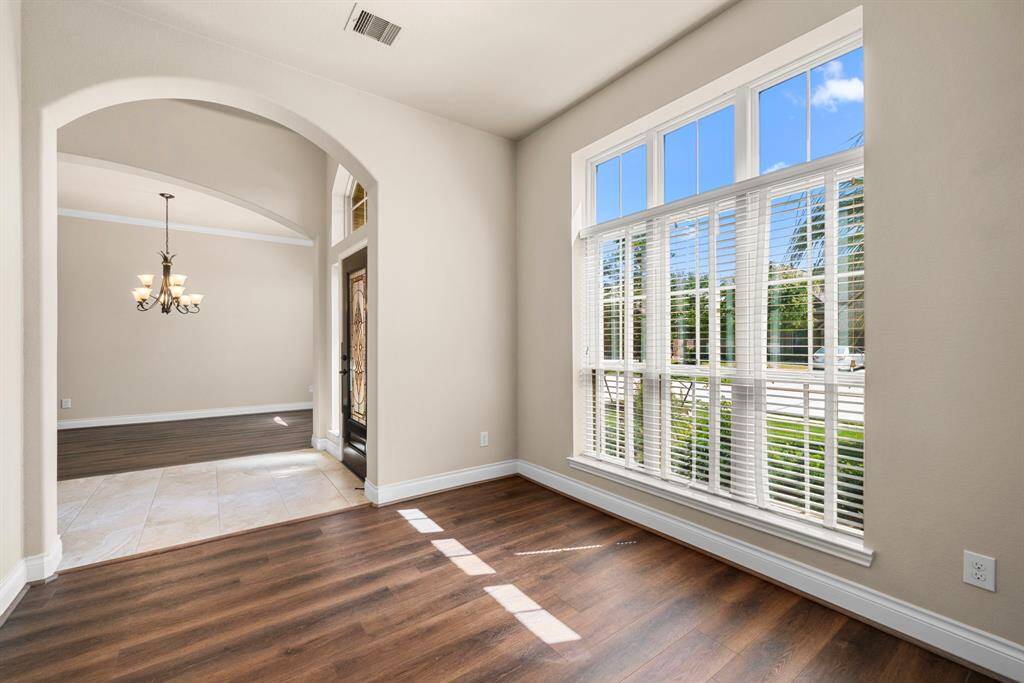 Enjoy a welcoming and functional layout as the front room flows effortlessly into the main living areas. Clean lines and neutral tones make this a versatile space to fit your lifestyle.