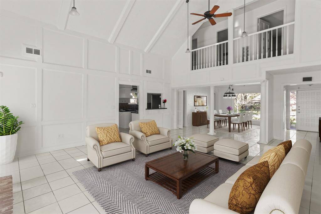 Virtually Staged: This living room is stunning and it provides easy access to the kitchen and dining area.