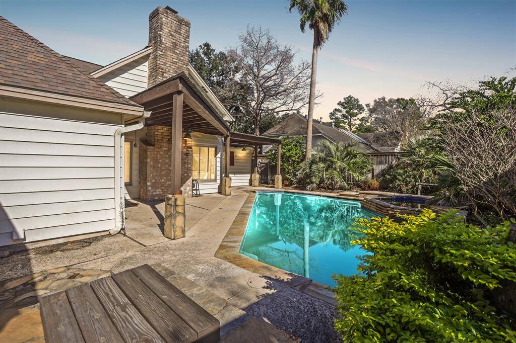 Look at your backyard oasis! This backyard offers an INCREDIBLE sparkling pool, and a covered patio making this an entertainers paradise!