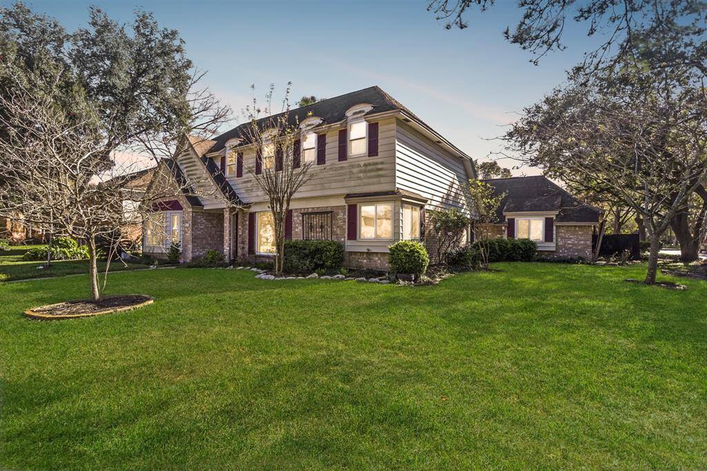 A beautiful array of windows allow natural light through the front of the home in this grand two story foyer.