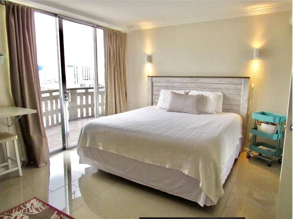 Bedroom with 3 closets and access to the balcony. Pictures are from previous staging.