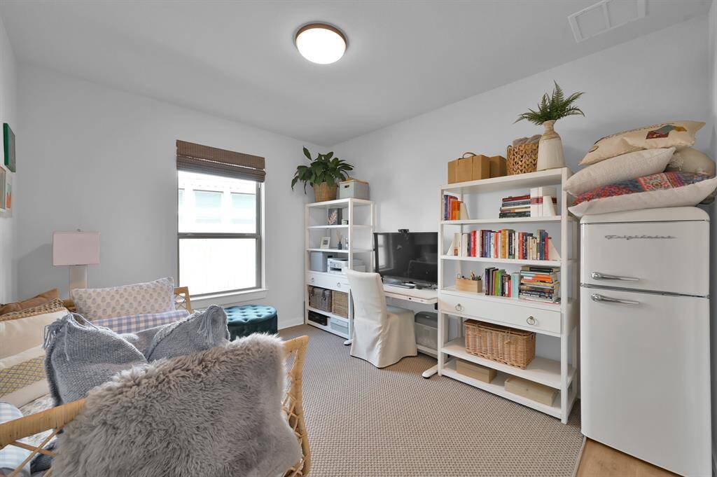 Need a home office or 4th bedroom? This flexible downstairs space offers privacy, natural light, and is conveniently located steps away from the half bath. **Furnished rental option available. Ask for details.**