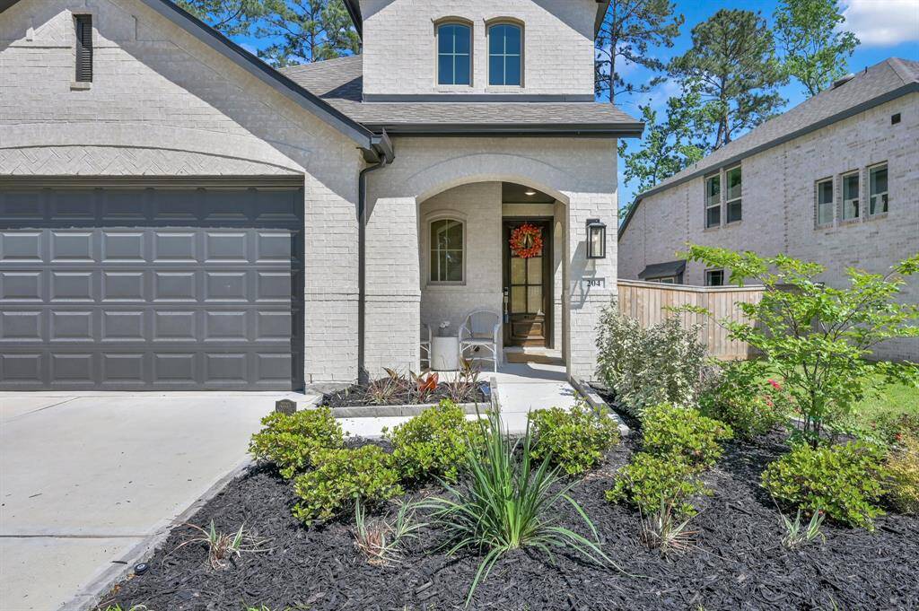 Landscaping and a charming covered front porch create the perfect welcome - for both you and your guests!