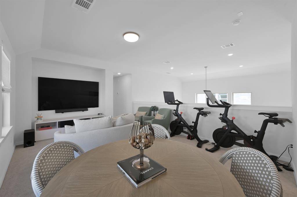 The upstairs game room is ready for whatever you have in mind - movie nights, workouts, game time, homeschooling, a second home office or second family room. **Furnished rental option available. Ask for details.**