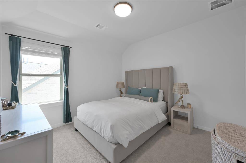 Bedroom #2. Both secondary bedrooms are located off the game room and feature tall ceilings, great natural light, and plenty of space, even for a king-sized bed. **Furnished rental option available. Ask for details.**