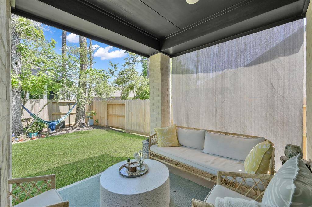 The covered back porch - a perfect place to relax or entertain. **Furnished rental option available. Ask for details.**