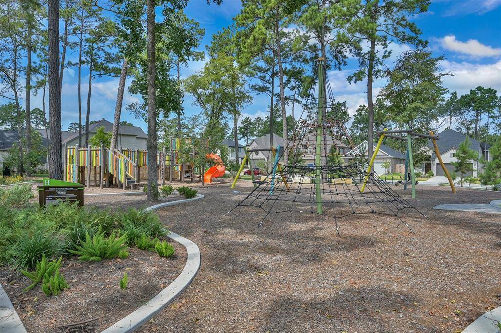 A view of the park with covered picnic table area located within walking distance. Just one of many parks throughout the master planned community.