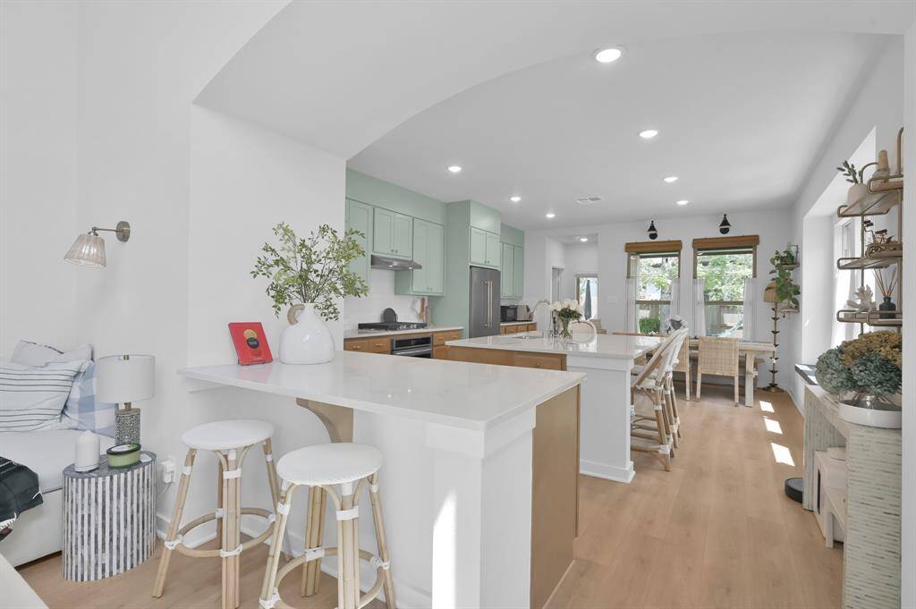 This dreamy kitchen checks all the boxes - endless counter space, a 5x7 island, cabinets galore, stainless steel appliances (the fridge stays!), recessed LED lighting, space for an oversized table, a cozy window seat and natural light.