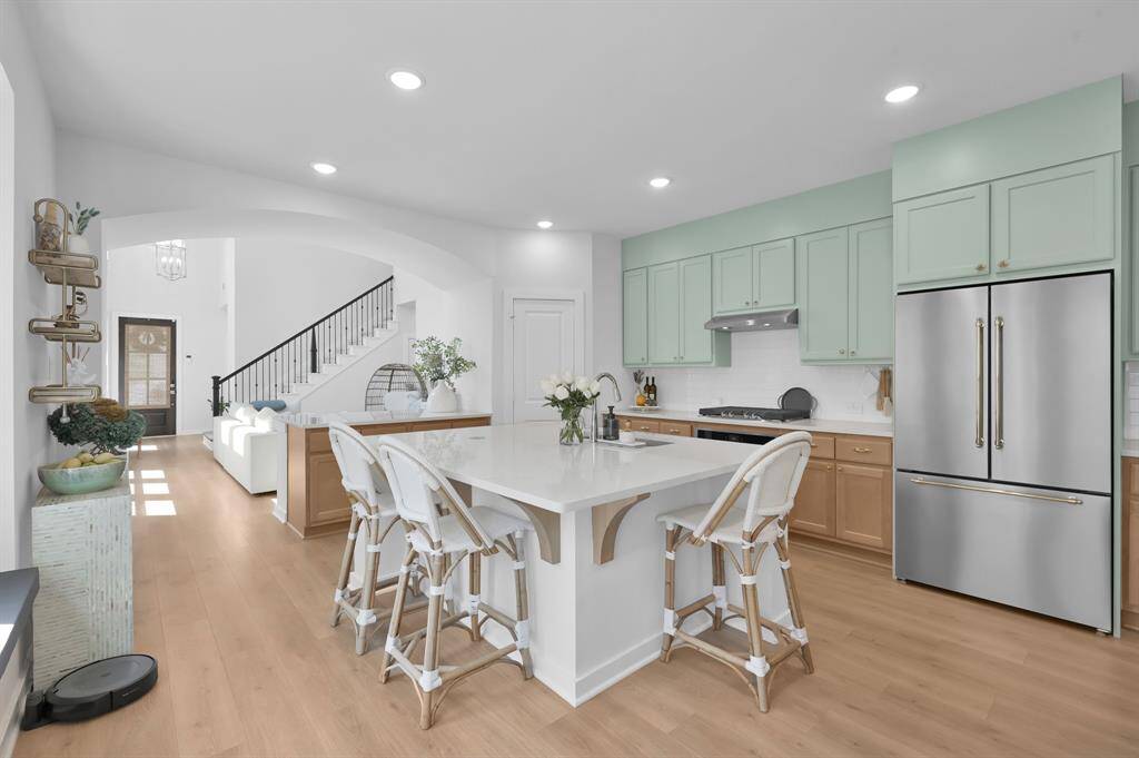 Another view of the kitchen. Notice the gold hardware on the fridge!