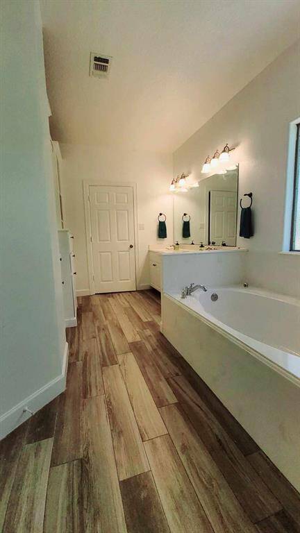 Plenty of storage & shelving in master bathroom